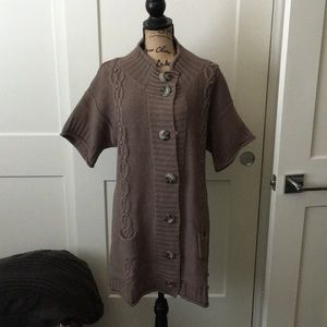 Brown sweater walking length.